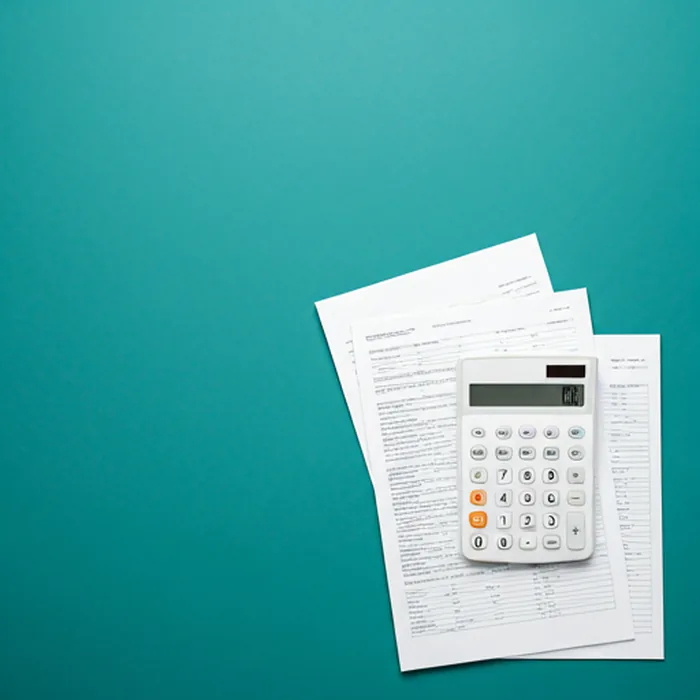 Financial documents and calculator on a teal background representing PF withdrawal process